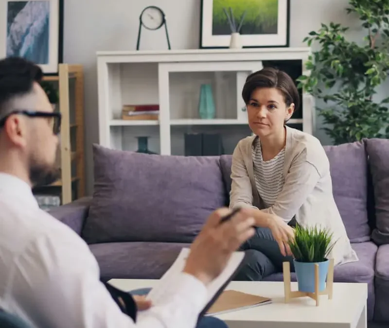 Woman in a therapy session with a psychologist